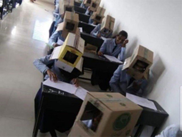 Indian students forced to wear cartons on their heads