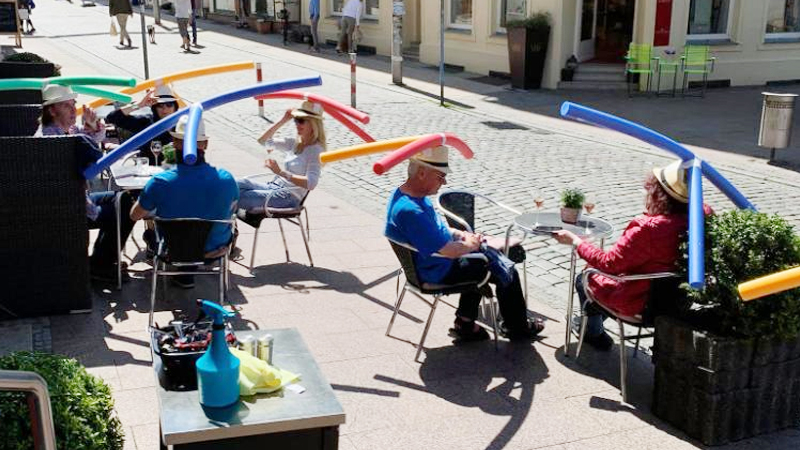 German cafe using pool noodles to ensure social distancing