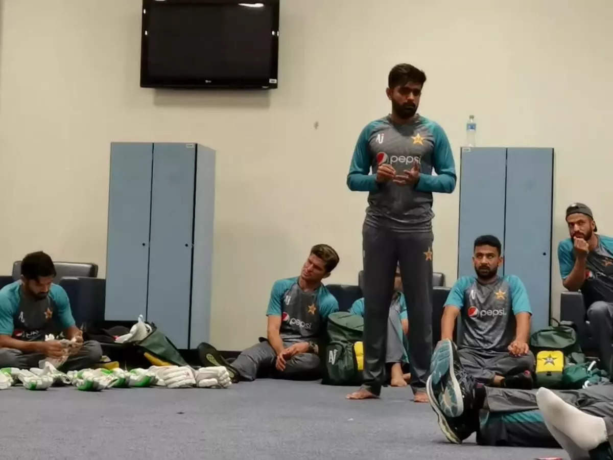 Babar Azam talks to the players after Pakistan’s historic win over India