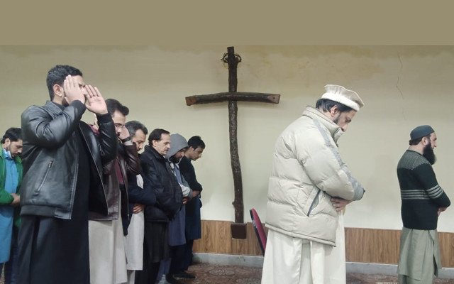 Muslim scholars pray inside a church of Peshawar in a show of solidarity with Christian community